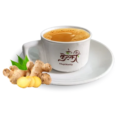 KT-Ginger-Tea Hot ginger tea in a white ceramic Aapli Kettly cup with fresh ginger root slices