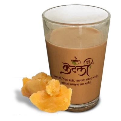 KT-Gulacha-Tea Traditional Gulacha Chaha or Jaggery tea in a signature Aapli Kettly glass with jaggery pieces